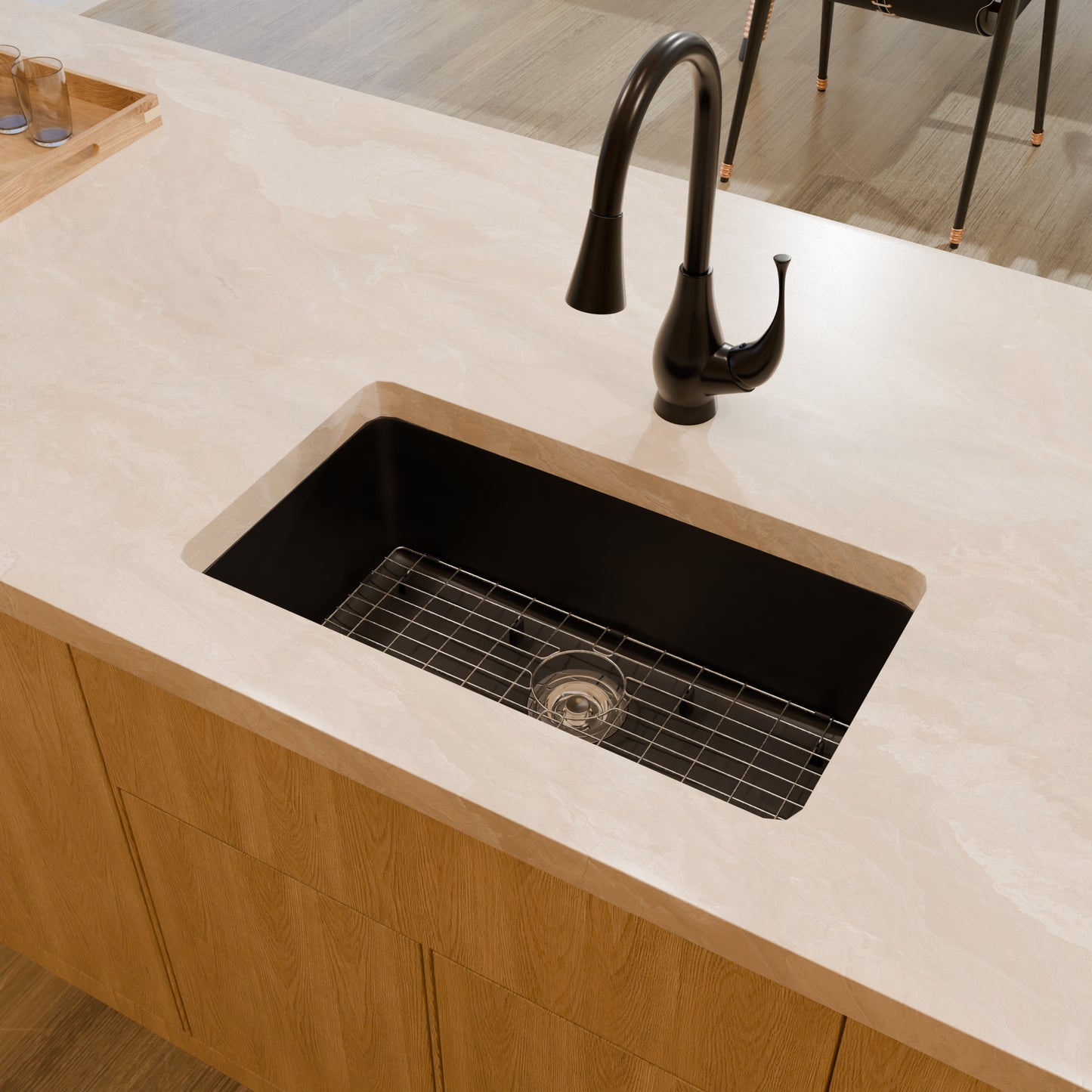 Black StoneCore 30-inch single bowl kitchen sink by Novatto, shown with matching faucet and accessories in a modern kitchen setup.