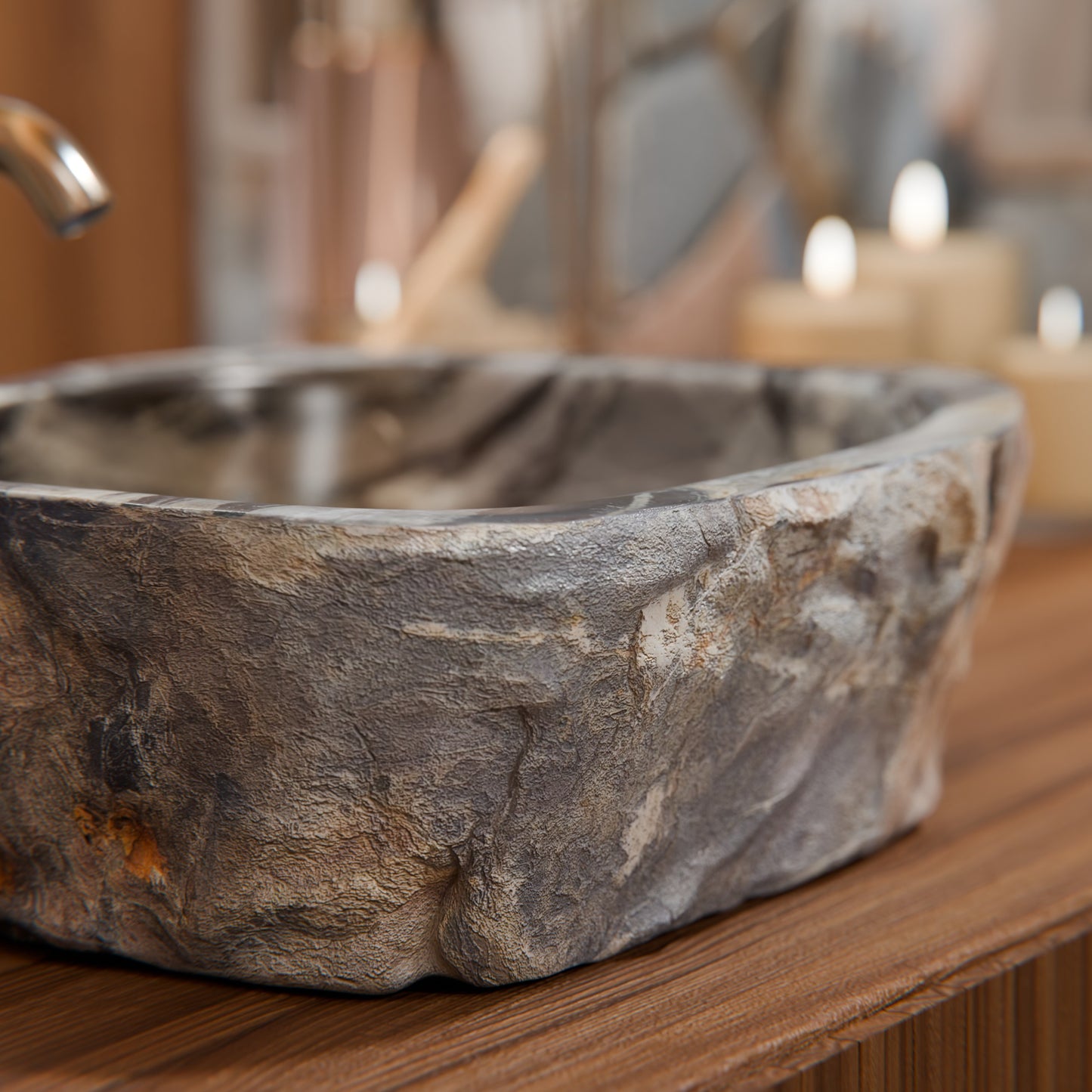 Natural irregular royal cobblestone vessel sink by Novatto, showcasing textured stone surface and elegant basin design.