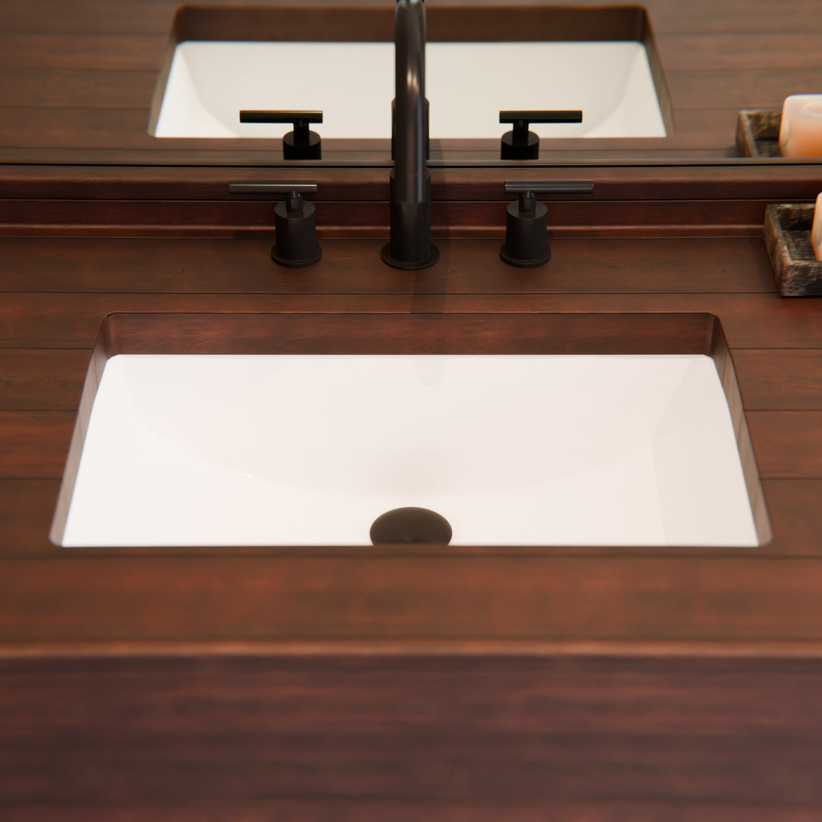 White porcelain undermount rectangular sink with overflow from Novatto, shown with wooden countertop and modern kitchen setting.