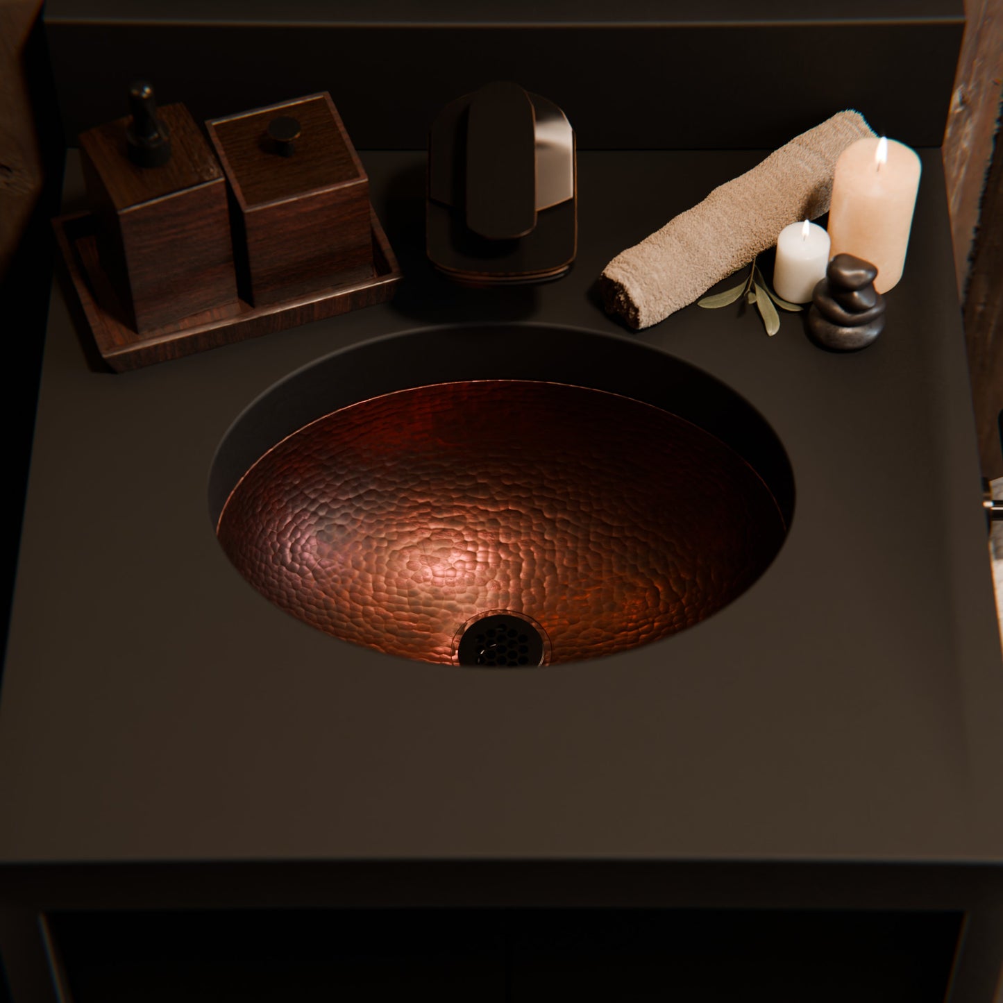 Small oval copper undermount bathroom sink in antique finish by Novatto, showcasing its traditional design and smooth surface.