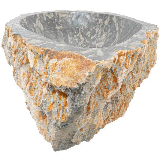 Natural irregular royal cobblestone vessel sink by Novatto with a sharp angular design, showcasing textured stone surface and modern style.