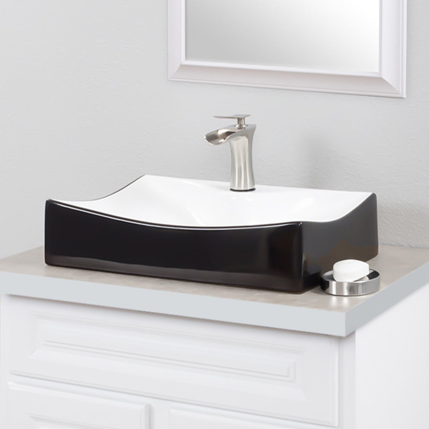 Rectangular black and white porcelain vessel sink from Novatto, side view showing sleek design and glossy finish.