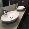 Oval Porcelain Sink Set with faucet and drain lifestyle
