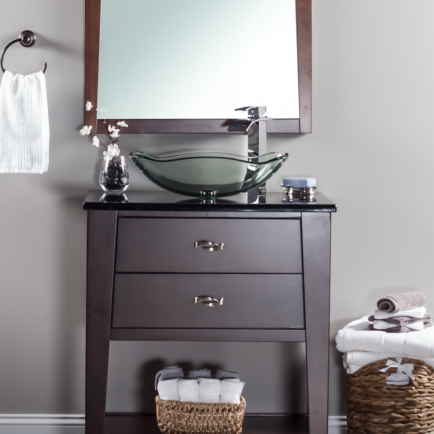 Modern clear scalloped tempered glass vessel bathroom sink by Novatto, shown with faucet and bathroom countertop setup.