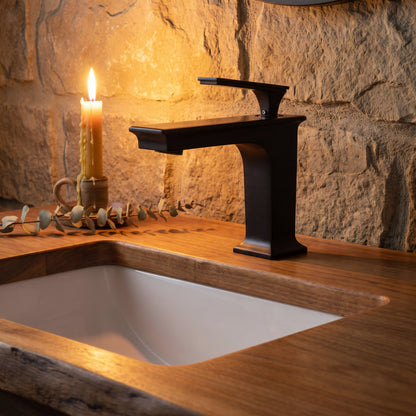 Novatto GF-368S series traditional single handle bathroom faucet in oil-rubbed bronze finish, mounted on a bathroom sink.