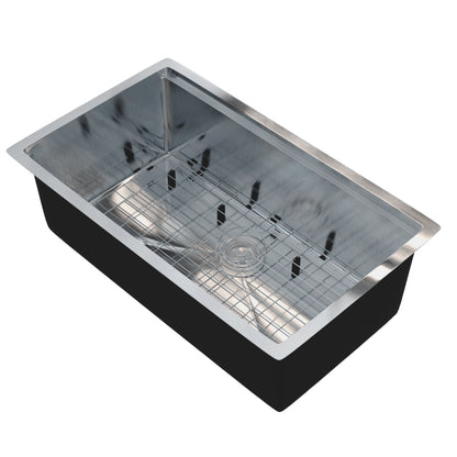 Novatto all-in single bowl stainless steel kitchen sink with workstation, commercial faucet, grate, and drain in a modern kitchen setting.