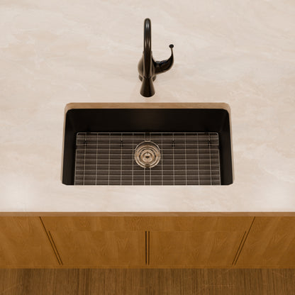 Novatto StoneCore 30-inch black single bowl kitchen sink with modern design and durable finish, shown with accessories and beauty set.