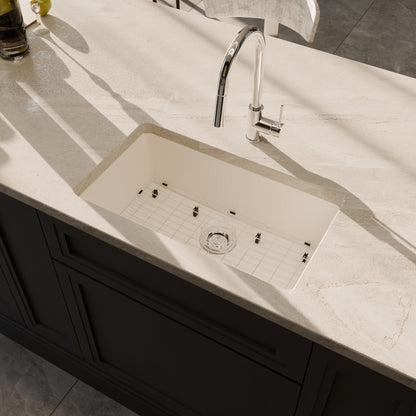 Novatto StoneCore 30-inch single bowl limestone kitchen sink with sleek design, shown with accessories in the image.