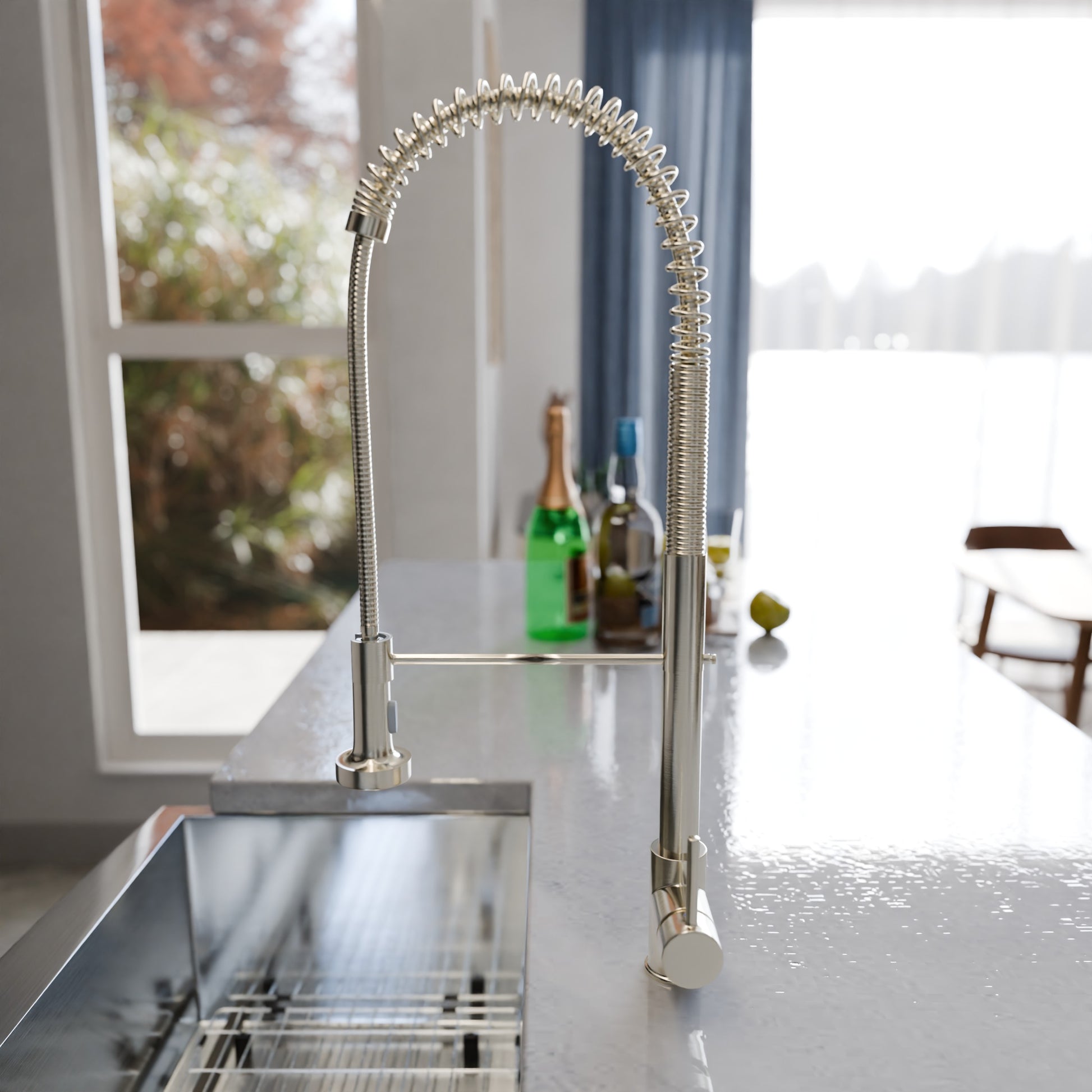 Stainless steel farmhouse kitchen sink with zero radius edges by Novatto, single bowl design, shiny finish, installed in a modern kitchen.
