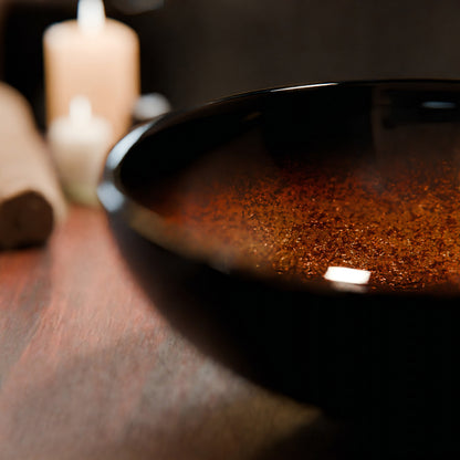 Mini 12-inch black and copper round glass vessel sink by Novatto, transitional bathroom sink with sleek glass design.