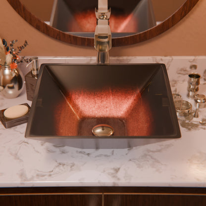 Modern copper and black square glass vessel bathroom sink by Novatto, with sleek, contemporary design and smooth glass surface.