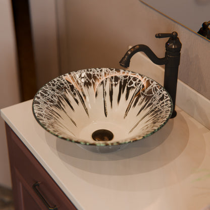 Modern Novatto Artsy round tempered glass vessel bathroom sink with dark finish, featuring a sleek, artistic design.