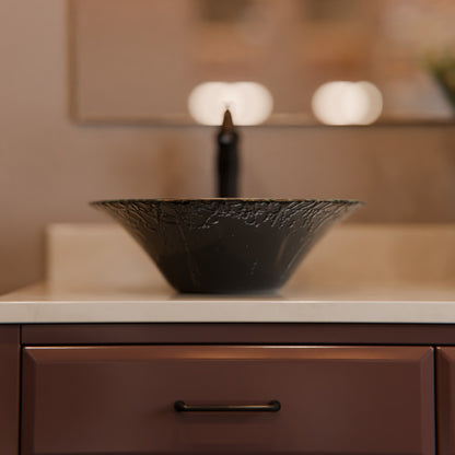 Modern round tempered glass vessel bath sink by Novatto, dark-colored, with smooth curved shape suitable for contemporary bathrooms.