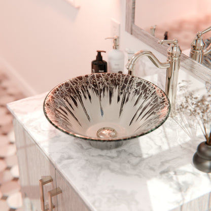 Modern Novatto Artsy round tempered glass vessel sink with sleek design, suitable for contemporary bathroom decor.