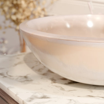 Transitional white onyx stone bathroom vessel sink by Novatto, featuring smooth polished surface and elegant curved design.