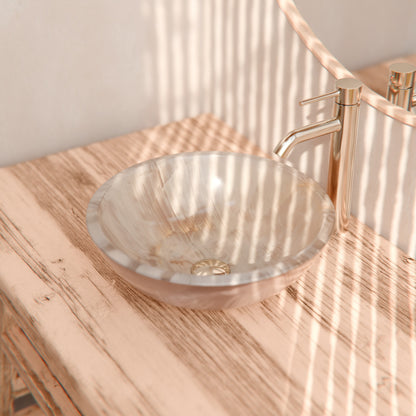 Natural white onyx stone vessel bathroom sink by Novatto, featuring a smooth, polished transitional design.