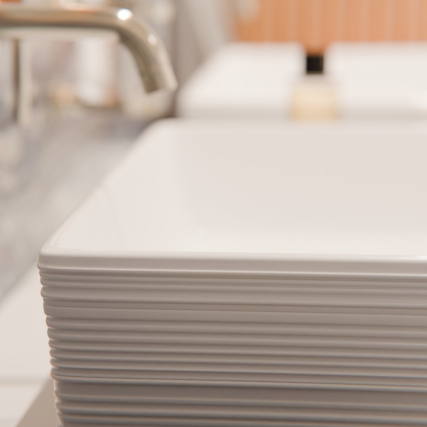 Rectangular white porcelain vessel sink with grooved exterior, Novatto NP-208513, showcasing smooth interior and modern design.