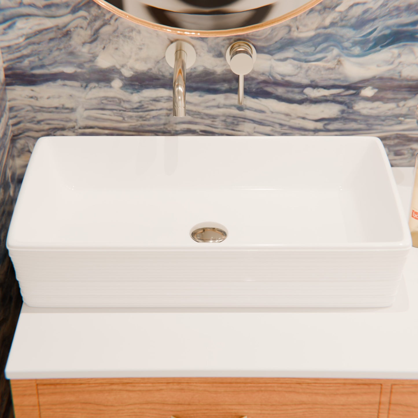 Rectangular white porcelain vessel sink with grooved exterior by Novatto, showcasing smooth interior and textured exterior design.