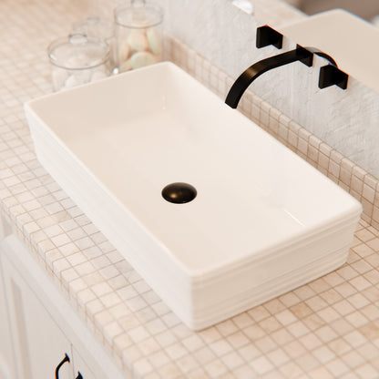 Rectangular white porcelain vessel sink with grooved exterior, Novatto NP-208513, shown with faucet and bathroom setup.