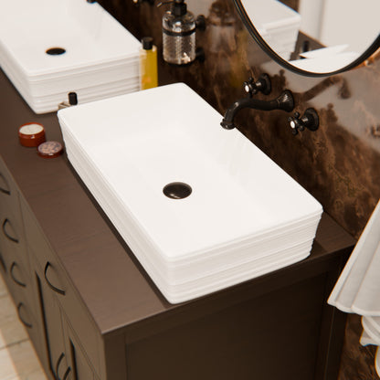 Rectangular white porcelain vessel sink with grooved exterior by Novatto, shown with brown faucet and countertop accessories.