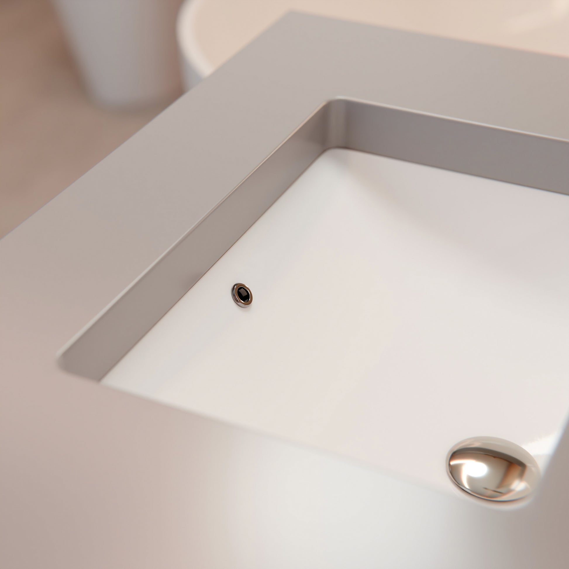 White rectangular undermount porcelain vessel sink with overflow, designed by Novatto, shown in the image.