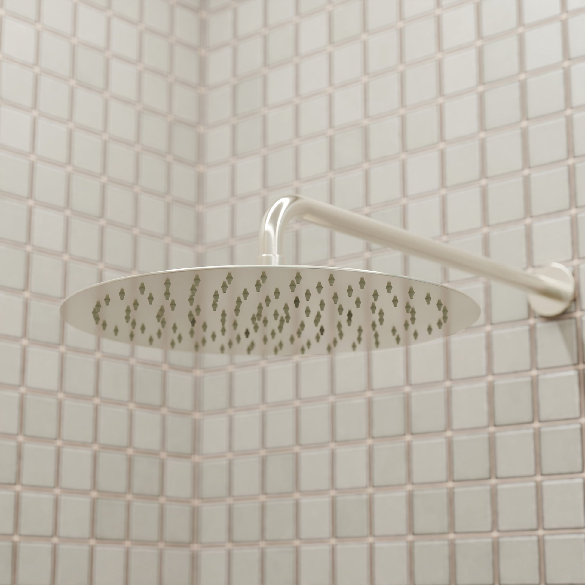 Novatto 12-inch round rainfall shower head for shower and bathtub, featuring a sleek chrome finish and wide water coverage.