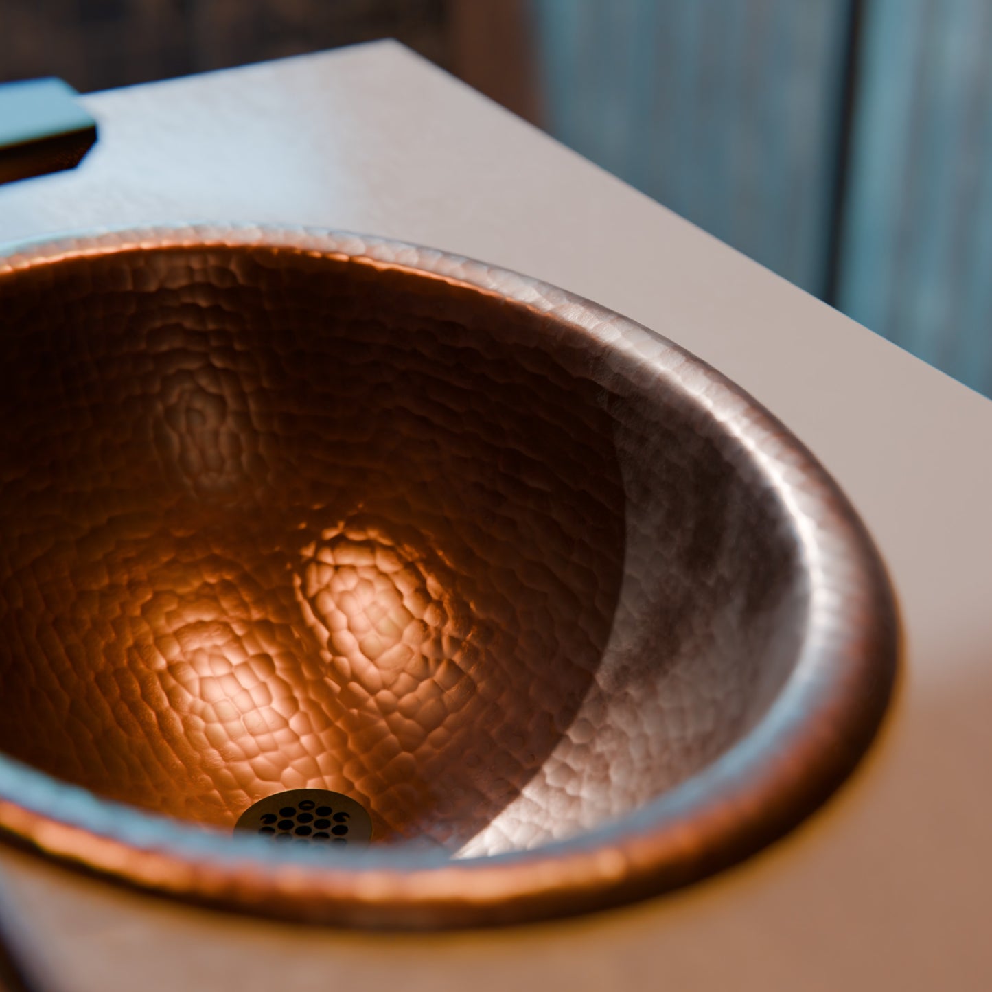 Oval rolled rim copper drop-in bath sink by Novatto, traditional antique finish, smooth interior with rounded edges.