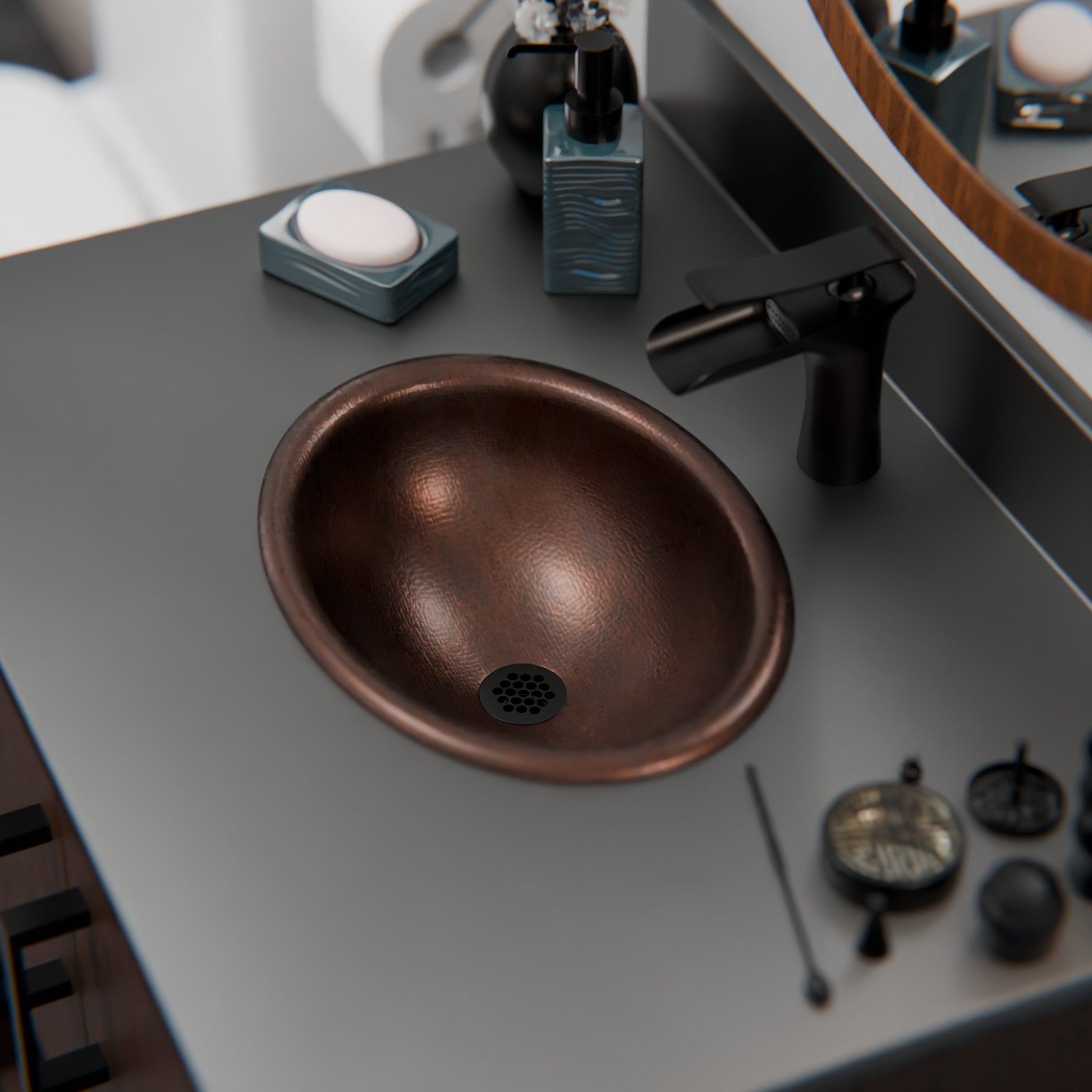 Small oval copper drop-in bathroom sink by Novatto with antique dark finish, designed for transitional bathroom decor.