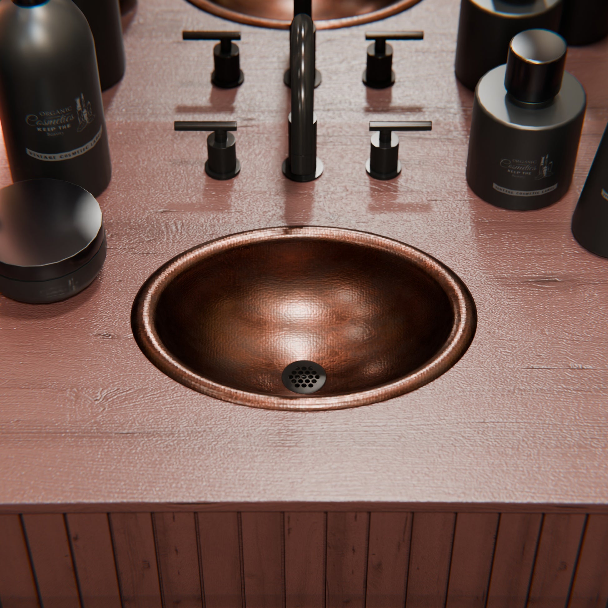 Small oval copper drop-in bathroom sink in antique finish by Novatto, with transitional style and polished copper appearance.