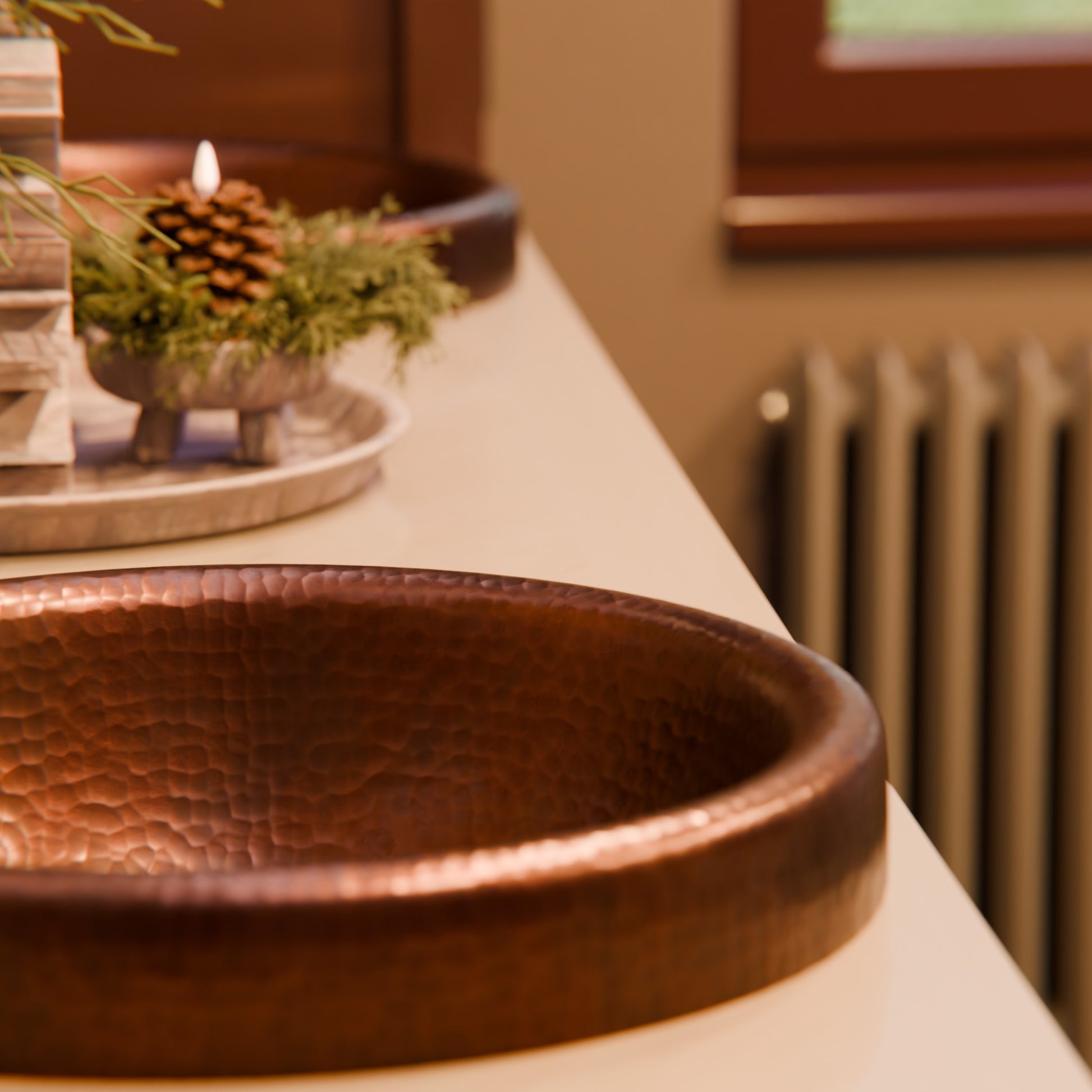 Round copper drop-in bathroom sink by Novatto with antique finish, traditional style, shown in a bathroom setting.