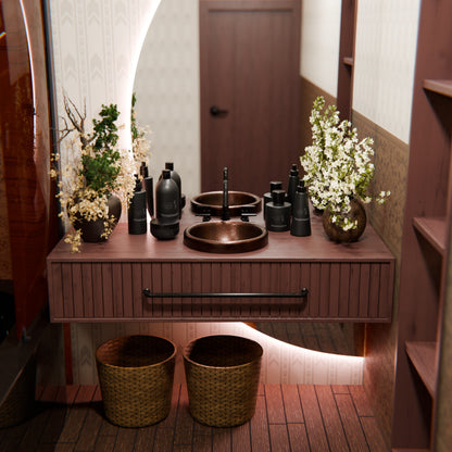 Round copper drop-in bathroom sink in antique finish by Novatto, showcasing a traditional design with a smooth, polished surface.