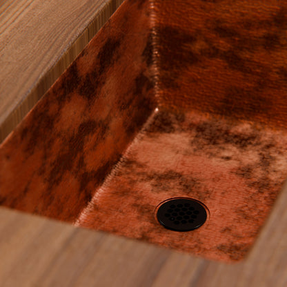 Rectangular copper traditional bathroom sink in natural finish by Novatto, with a smooth, polished surface and elegant design.