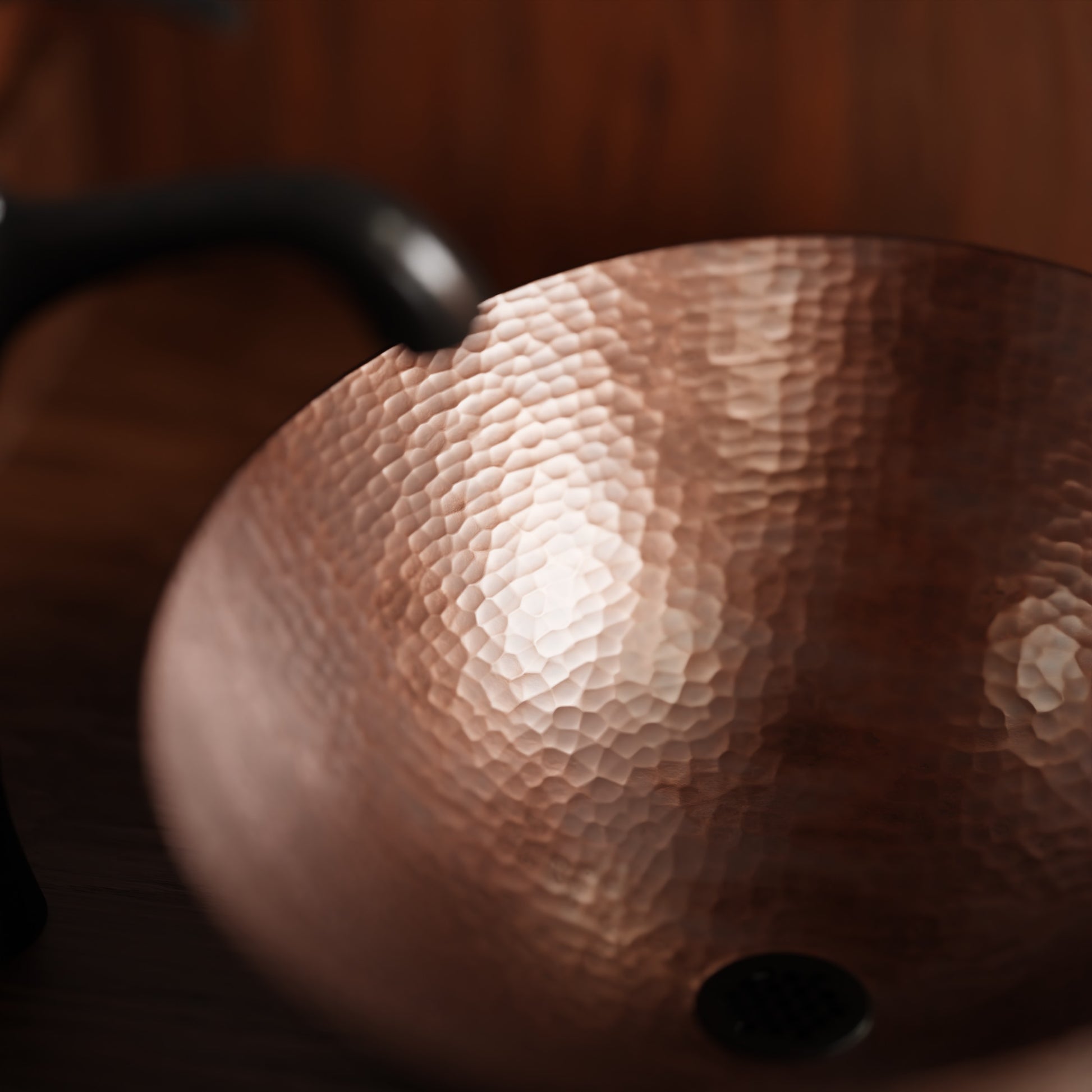 Oval hammered copper vessel bath sink by Novatto, traditional antique-style bathroom sink with a textured copper finish.