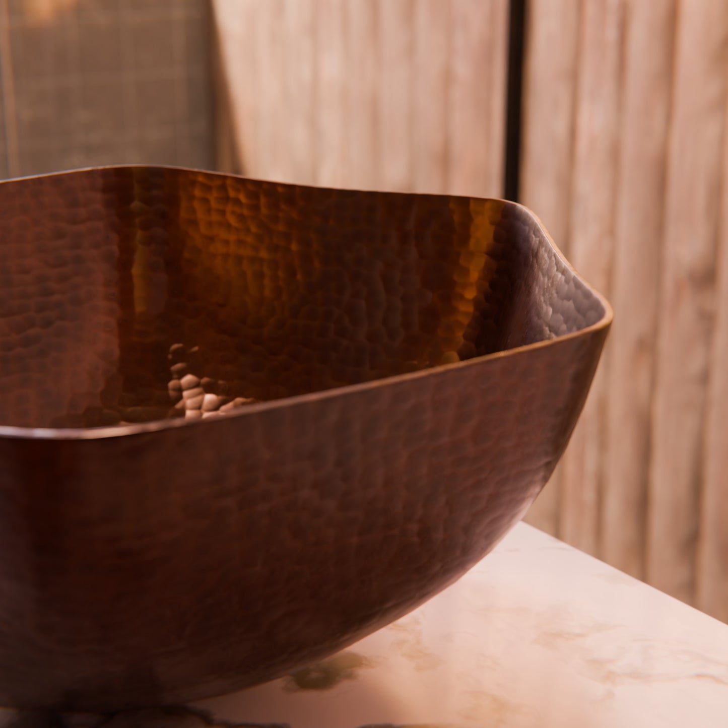 Traditional hammered copper vessel sink with scalloped edges in antique finish, by Novatto for bathroom decor.