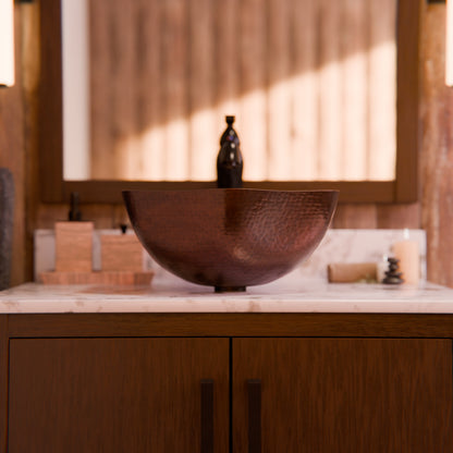 Traditional hammered copper vessel sink with scalloped edges in antique finish by Novatto, ideal for elegant bathroom decor.