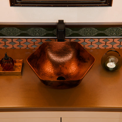 Traditional hammered copper vessel sink with scalloped edges in antique finish by Novatto, perfect for elegant bathroom decor.