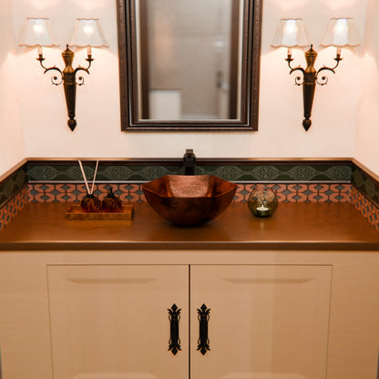 Traditional hammered copper vessel sink with scalloped edges, antique finish, by Novatto, ideal for elegant bathroom decor.