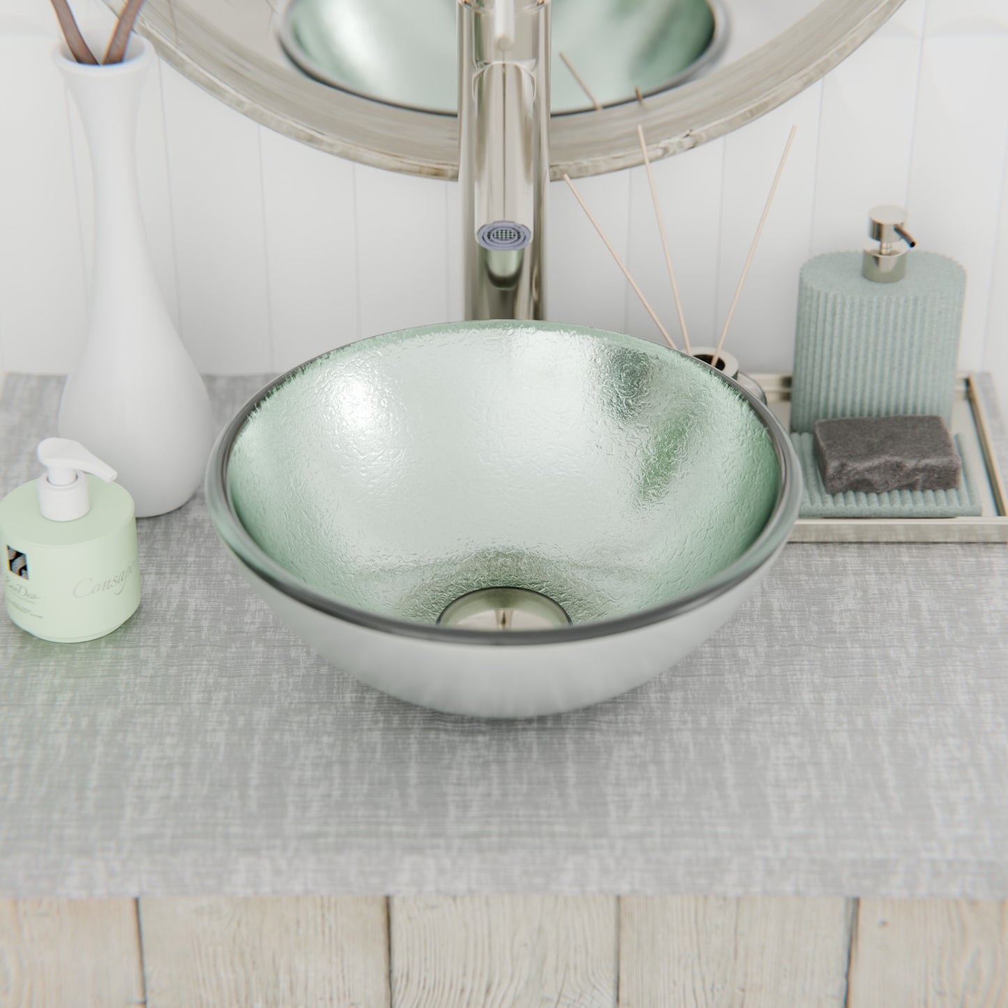 Mini 12-inch silver foiled round glass vessel bathroom sink by Novatto, modern design with sleek glass finish.