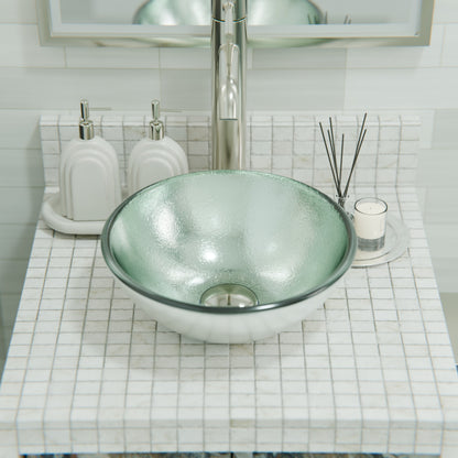 Mini 12-inch silver foiled round glass vessel bathroom sink by Novatto, modern design with a sleek glass finish.
