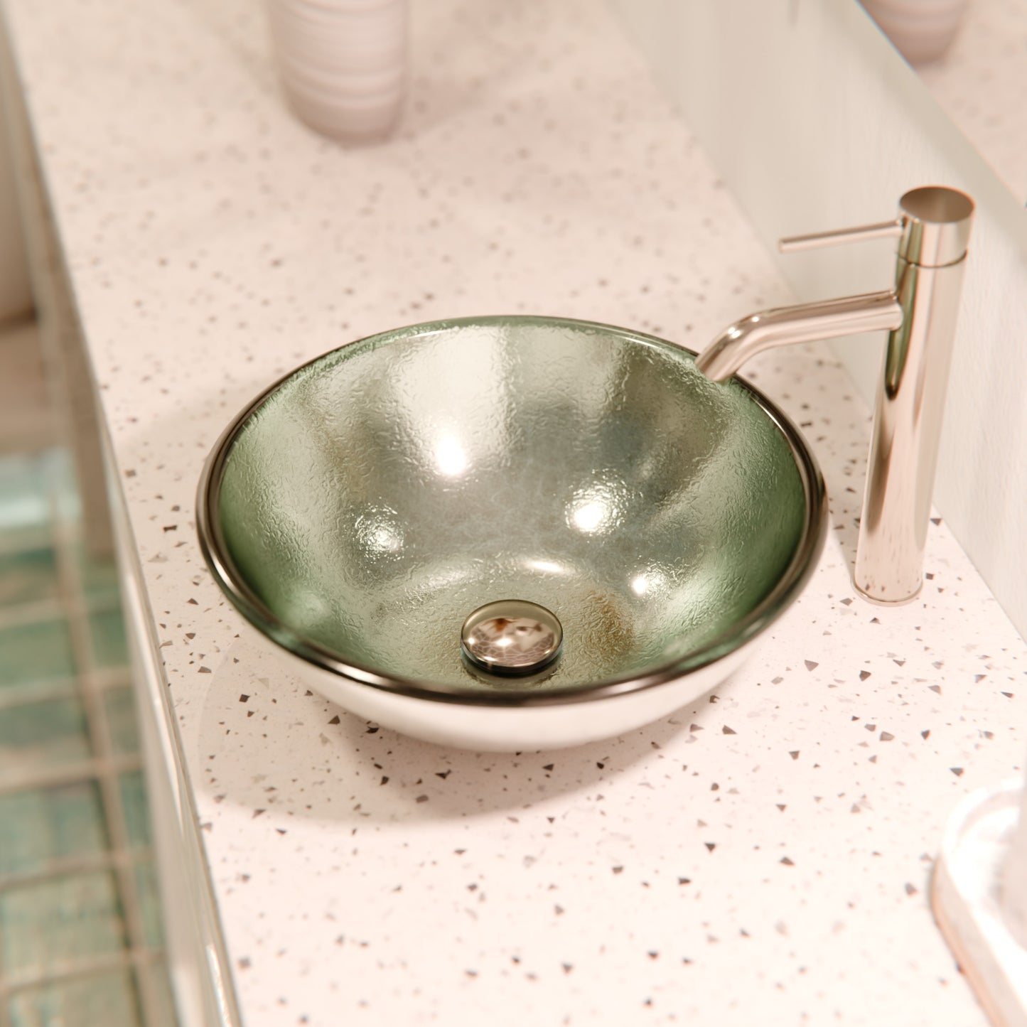 Modern silver foiled round tempered glass vessel bath sink by Novatto, featuring a sleek design and smooth glass surface.
