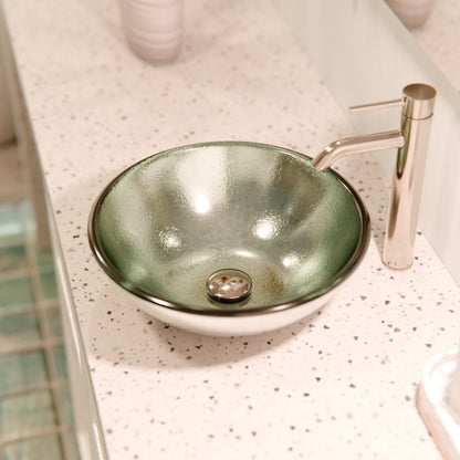 Modern silver foiled round tempered glass vessel bath sink by Novatto, featuring a sleek design and smooth glass surface.
