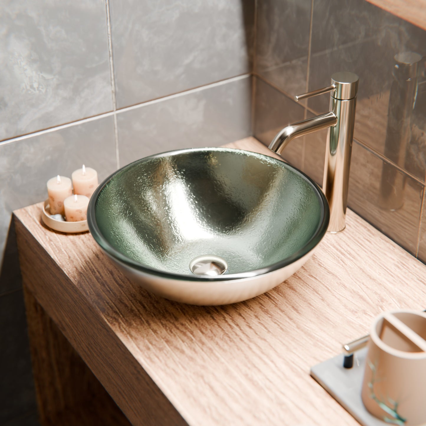 Silver foiled round tempered glass vessel bathroom sink by Novatto with a modern design, shown on a wooden surface.
