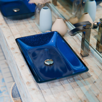 Blue hand-foiled rectangle glass vessel bathroom sink by Novatto, modern design with clear, smooth glass surface.