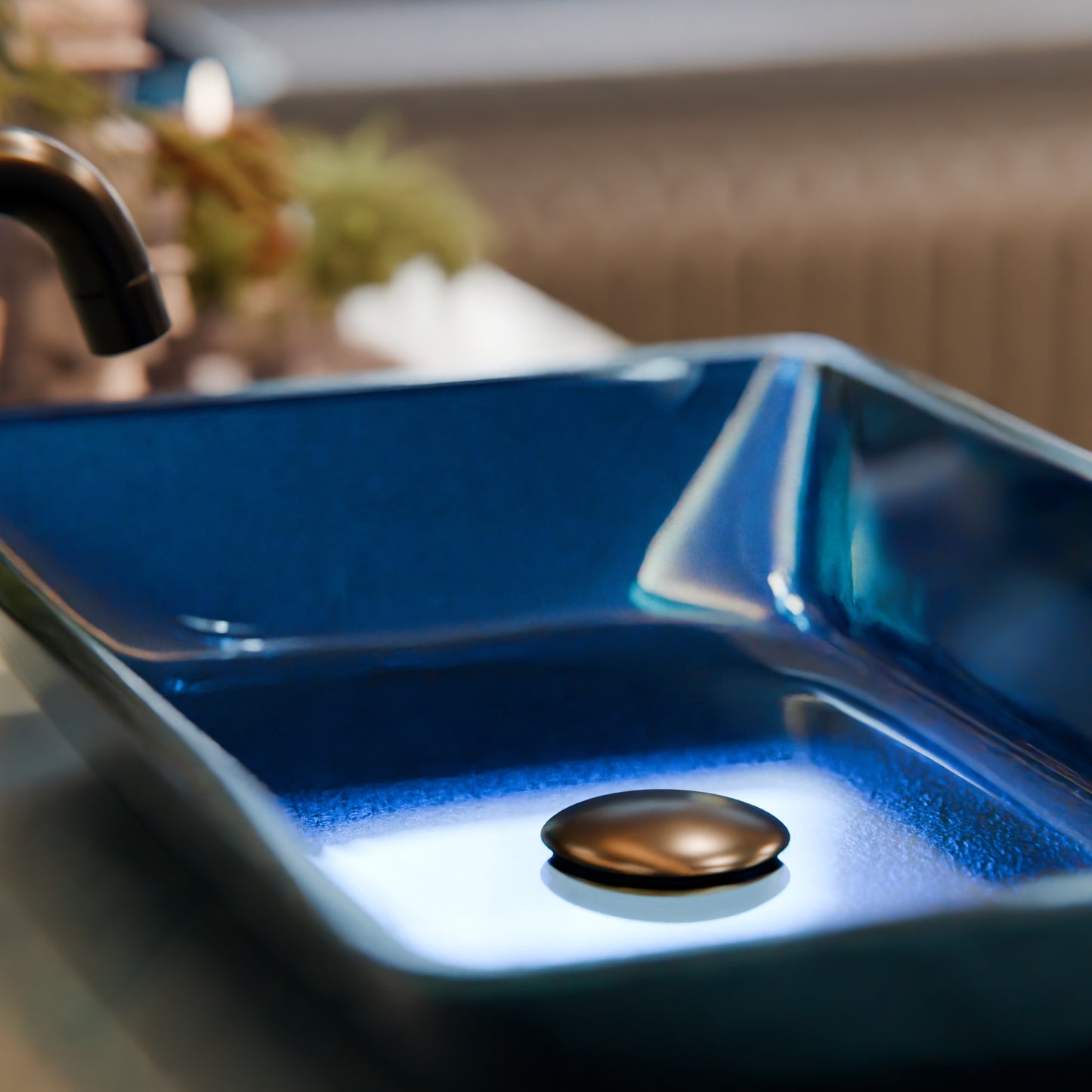 Blue hand-foiled rectangle glass vessel bathroom sink by Novatto, modern design with sleek glass surface.