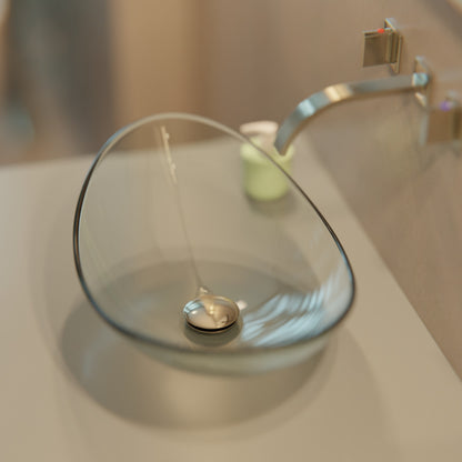Clear oval tempered glass vessel sink by Novatto, modern bathroom design with sleek oval shape and transparent finish.