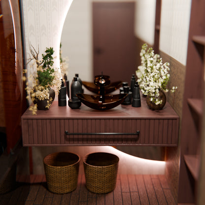 Modern brown oval tempered glass vessel sink by Novatto, designed for stylish bathroom use, with a clear and smooth surface.