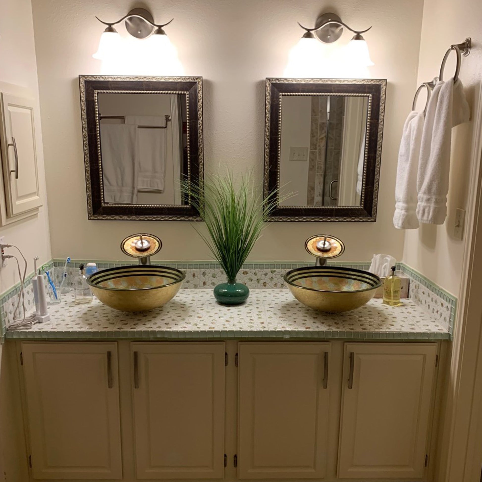Hand-painted multicolored glass vessel bathroom sink by Novatto, traditional design with vibrant, artistic glass surface.
