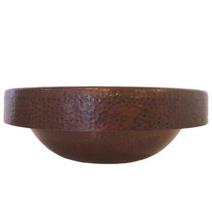 Side view of Novatto round copper drop-in bathroom sink in antique finish, traditional style with smooth curves and polished surface.