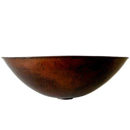 Traditional oval hammered copper vessel bathroom sink in antique finish by Novatto, side view showing textured surface and rounded shape.