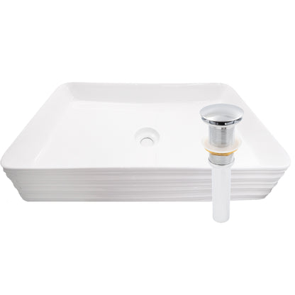 White porcelain vessel sink with rectangular shape and grooved exterior, designed for modern bathroom decor by Novatto.